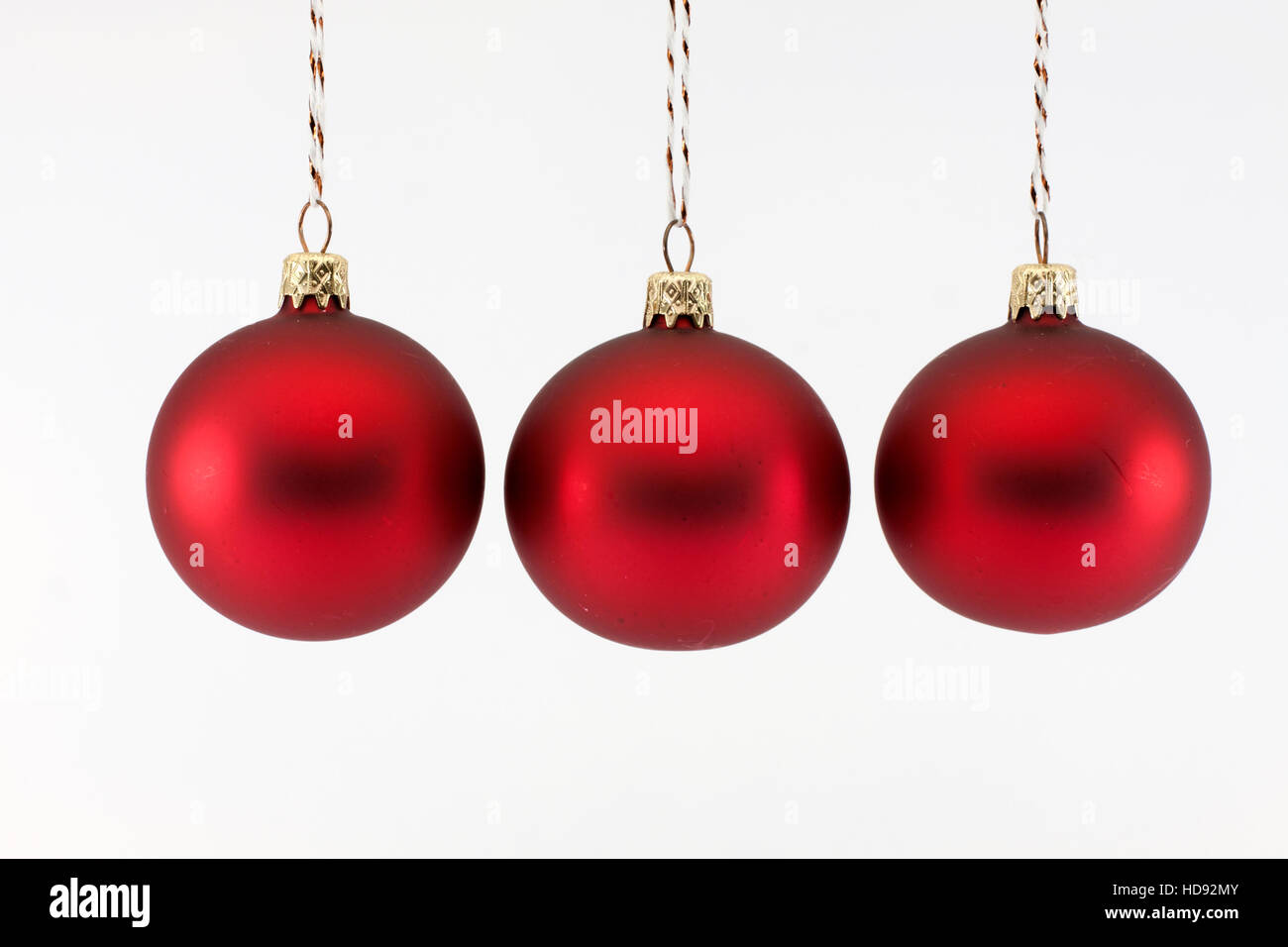 Three red Christmas balls photographed on a white background Stock ...