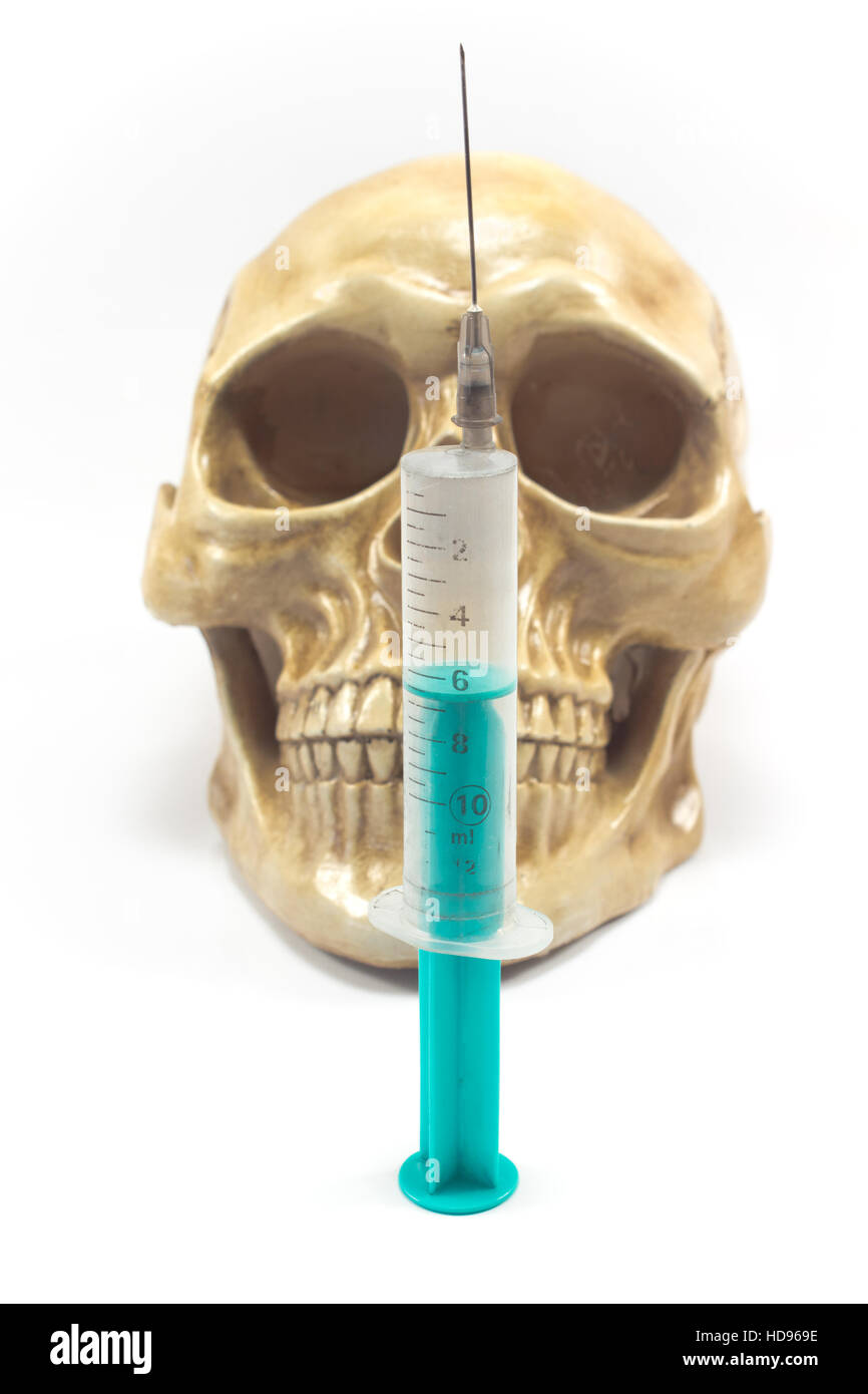 Syringe ove human skull isolated on white Stock Photo