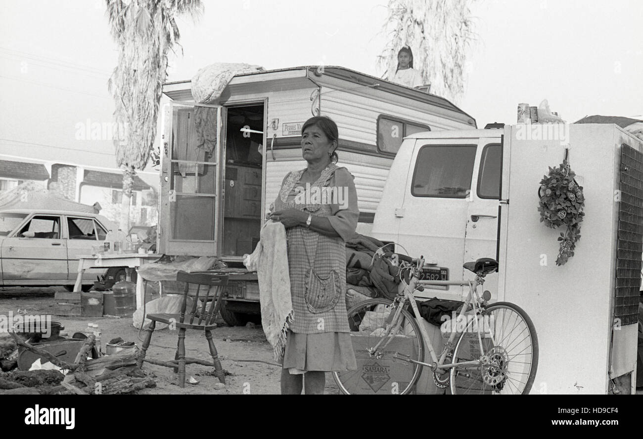 Latinos live in tents and cars outside their destroyed apartment buildings after the 1994 Northridge Earthquake in the Los Angeles area. (Photo by Jeremy Hogan) Stock Photo