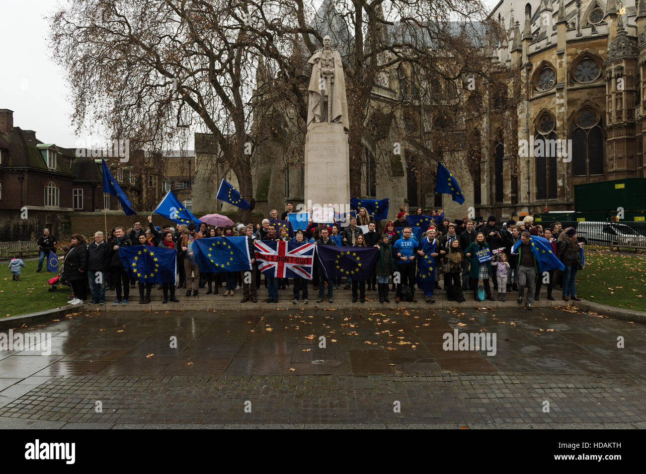 London, UK. 10th December 2016. A large group of pro-EU supporters gather in Old Palace Yard to take part in 'The Silent Chain For Europe' event on Human Rights Day. Participants link arms around the George V statue and remain silent in a symbolic act of concern about the existing rights of people living in the UK guaranteed by the European Union membership and threatened by Brexit. Wiktor Szymanowicz/Alamy Live News Stock Photo