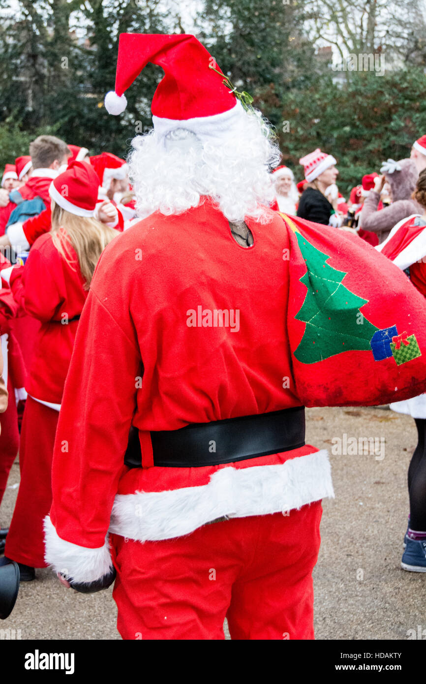 London, England, UK. 10 December 2016. Santacon Santas on the streets of London. Santacon is a non-religious Christmas parade that normally takes place in London one Saturday each December.  Credit:  Jansos/ Alamy Live News Stock Photo