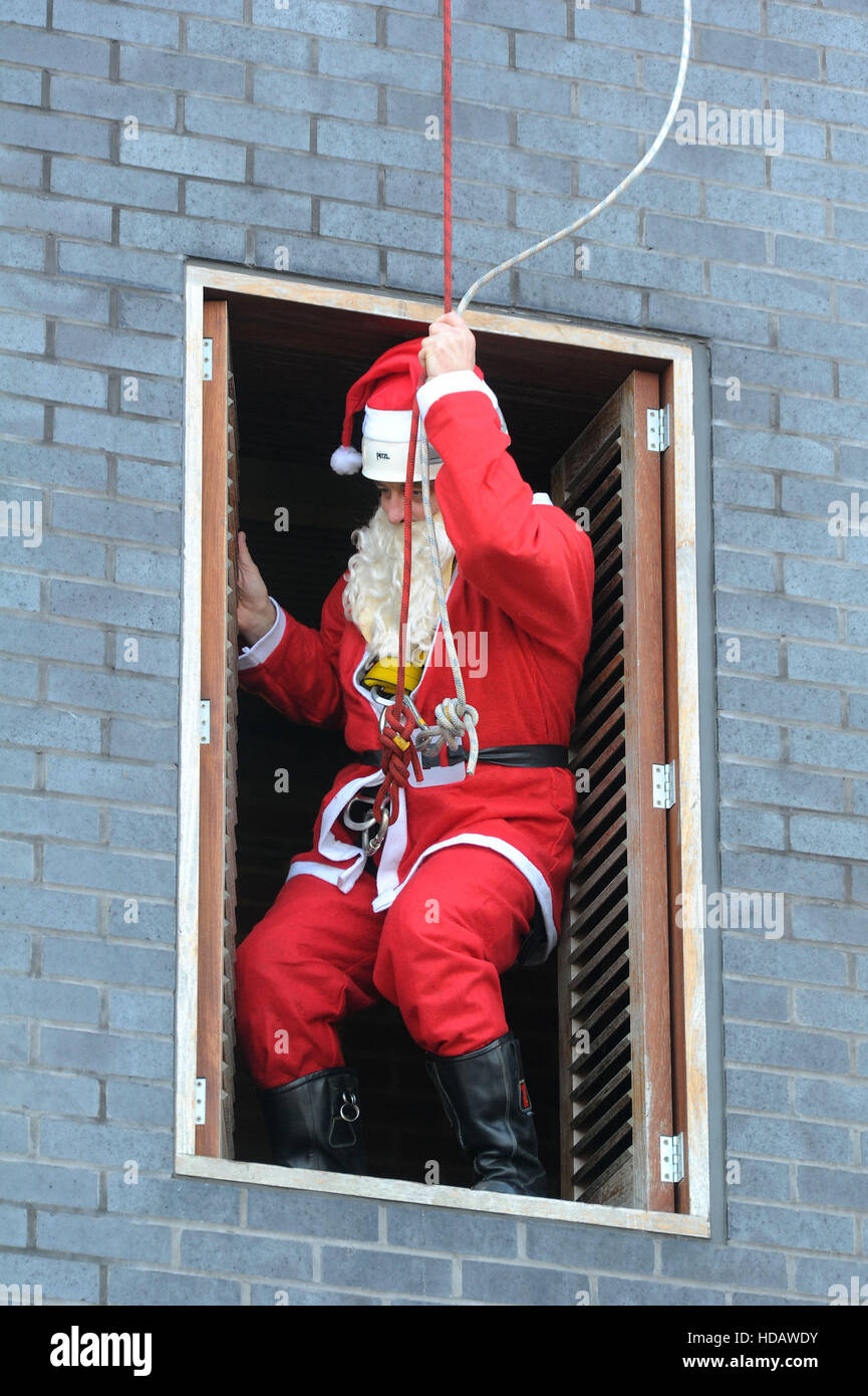 Weymouth, Dorset, UK. 11th Dec, 2016. Santa abseils in at Weymouth Fire Station, Dorset, UK Credit:  Dorset Media Service/Alamy Live News Stock Photo