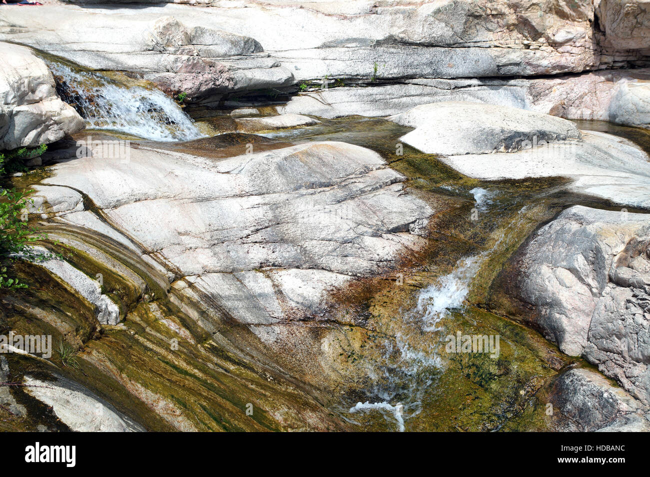 Mossy Rocks Fall Cascade falls over mossy rocks in deep forest Stock Photo - Alamy