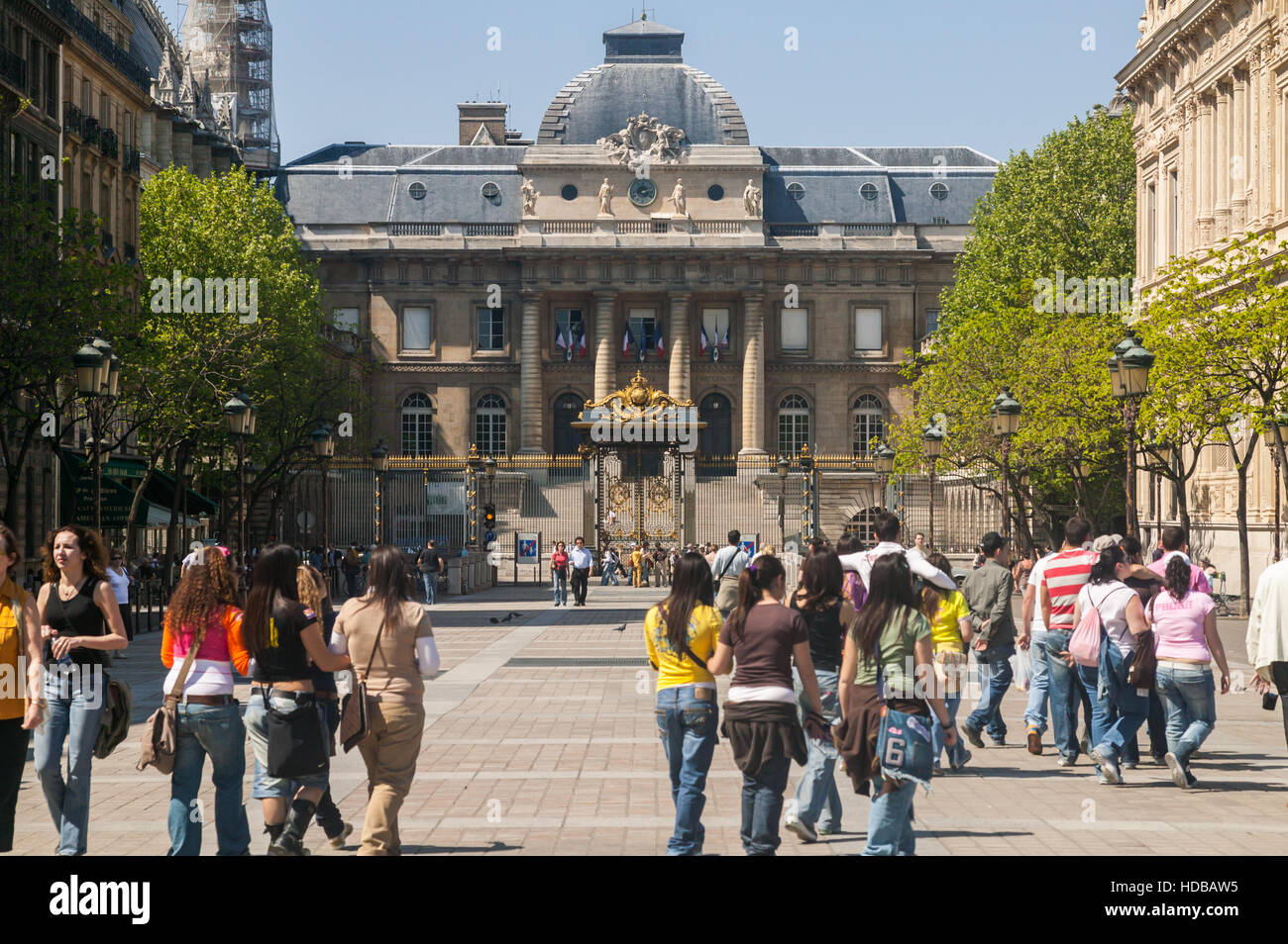 Students and tourists walk in the Place Louis Lepine near the Palais de Justice on the Ile de la Cite in Paris, France. Stock Photo