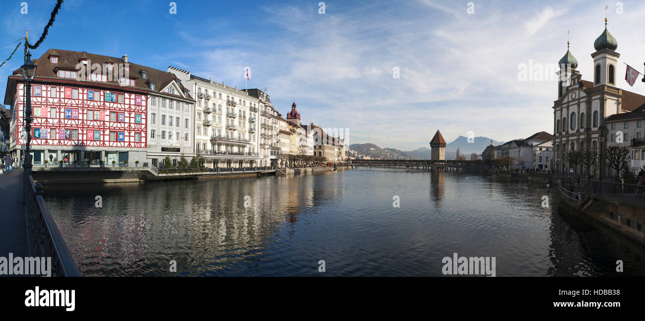 Switzerland, Europe: panoramic view of the skyline of the medieval city of Lucerne with the Jesuit Church, the Water Tower and the Chapel Bridge Stock Photo