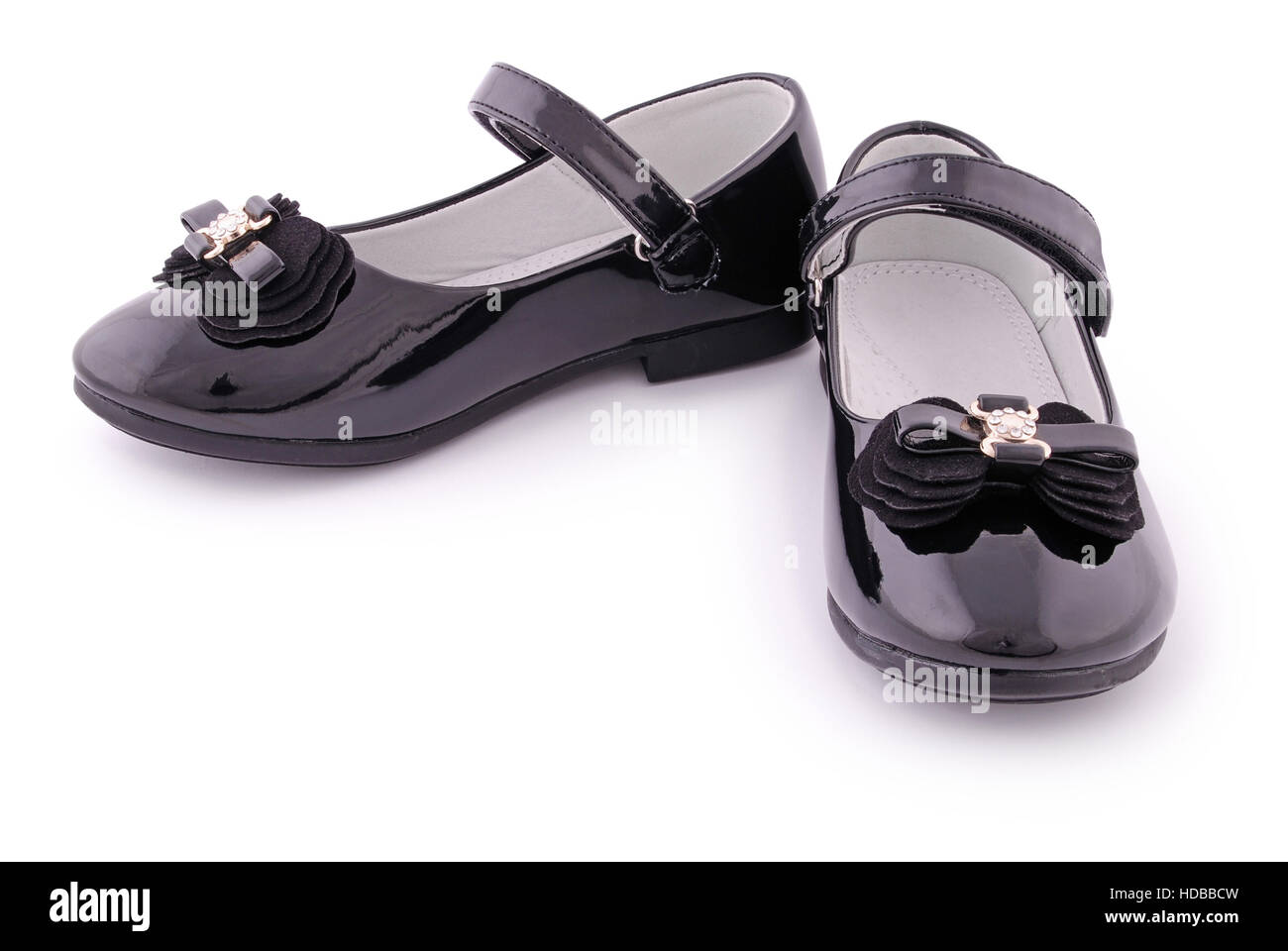 Pair of children's black patent leather shoes. Clipping path included ...