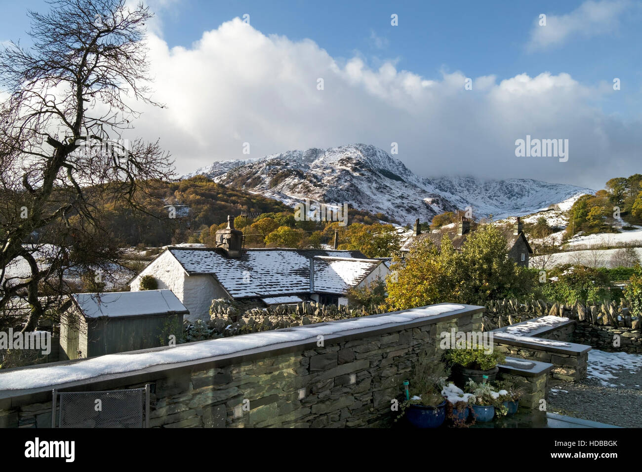 Little Langdale cottages and Wetherlam Fell in snow, English Lake District, Cumbria, England, UK. Stock Photo