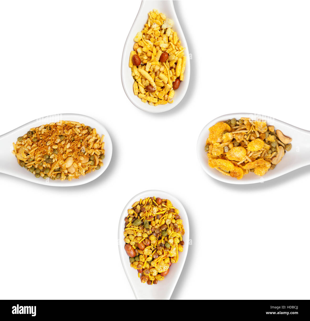 Dry roasted Indian snack mix in a big spoon, isolated Stock Photo - Alamy