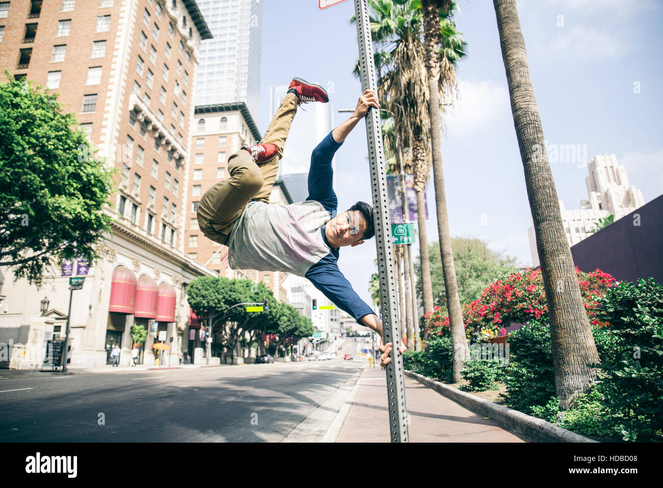 Parkour man doing tricks on the street - Free runner training his acrbatic  port outdoors Stock Photo - Alamy