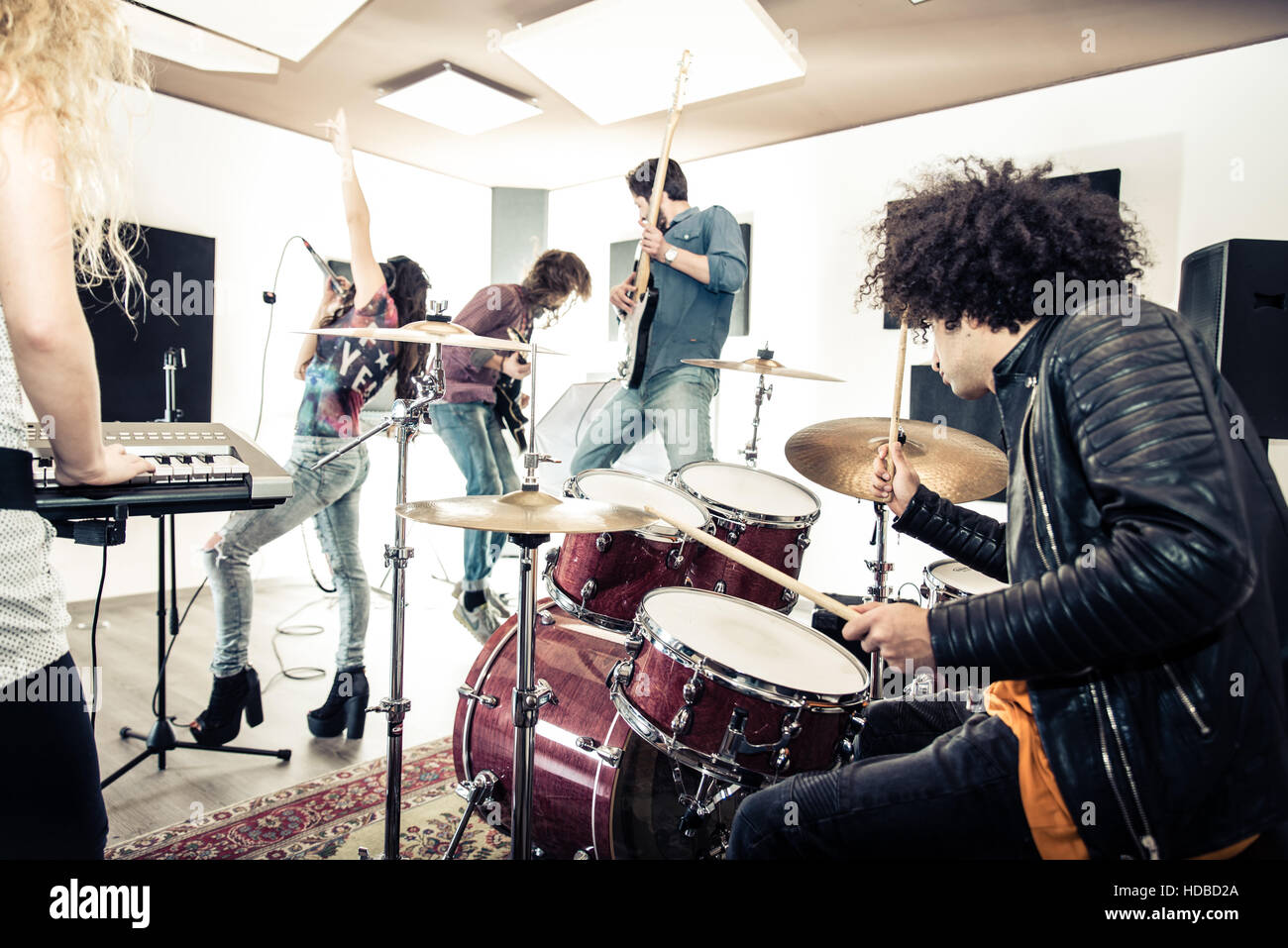 Rock band recording a track in a music studio Stock Photo Alamy