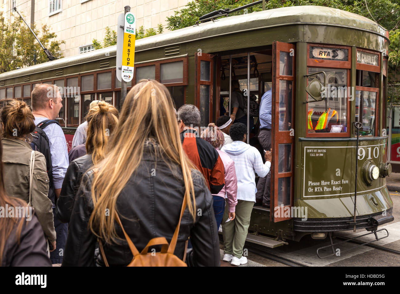 Passengers board an RTA St Charles Line streetcar at the Canal and Carondelet stop in New Orleans, Louisiana. Stock Photo