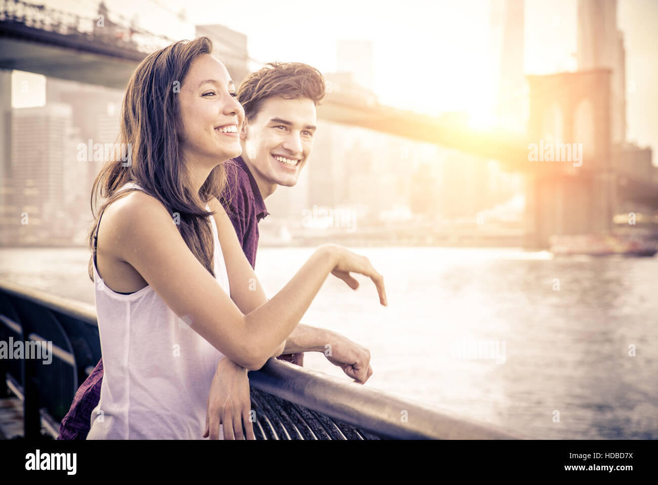 Cheerful couple talking and having fun on a romantic date Two friends having fun while looking