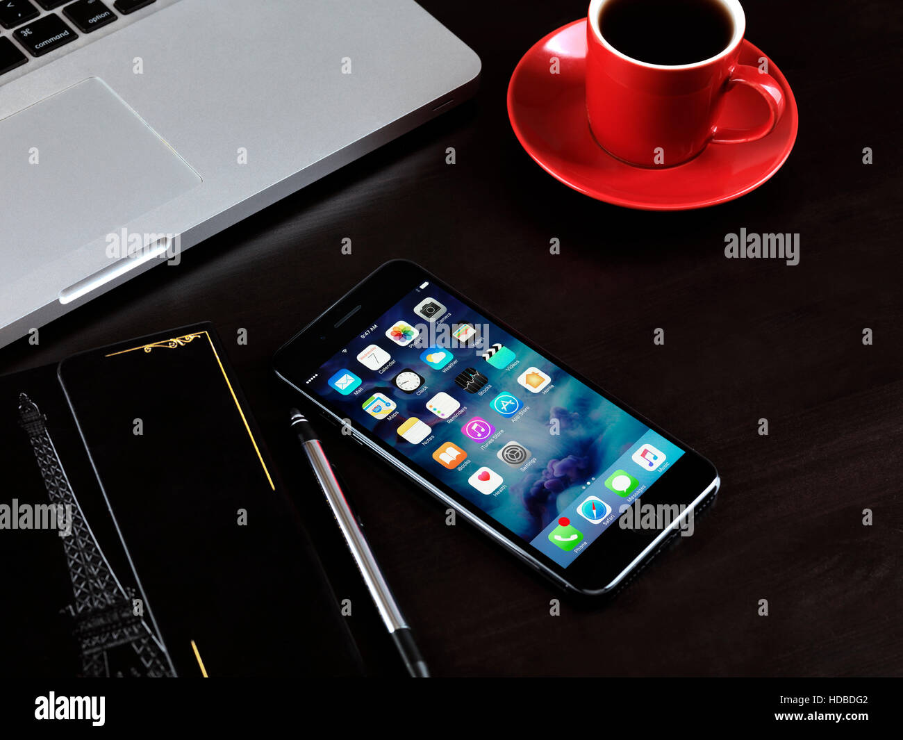Apple Iphone 7 Plus On A Desk With A Cup Of Coffee A Macbook
