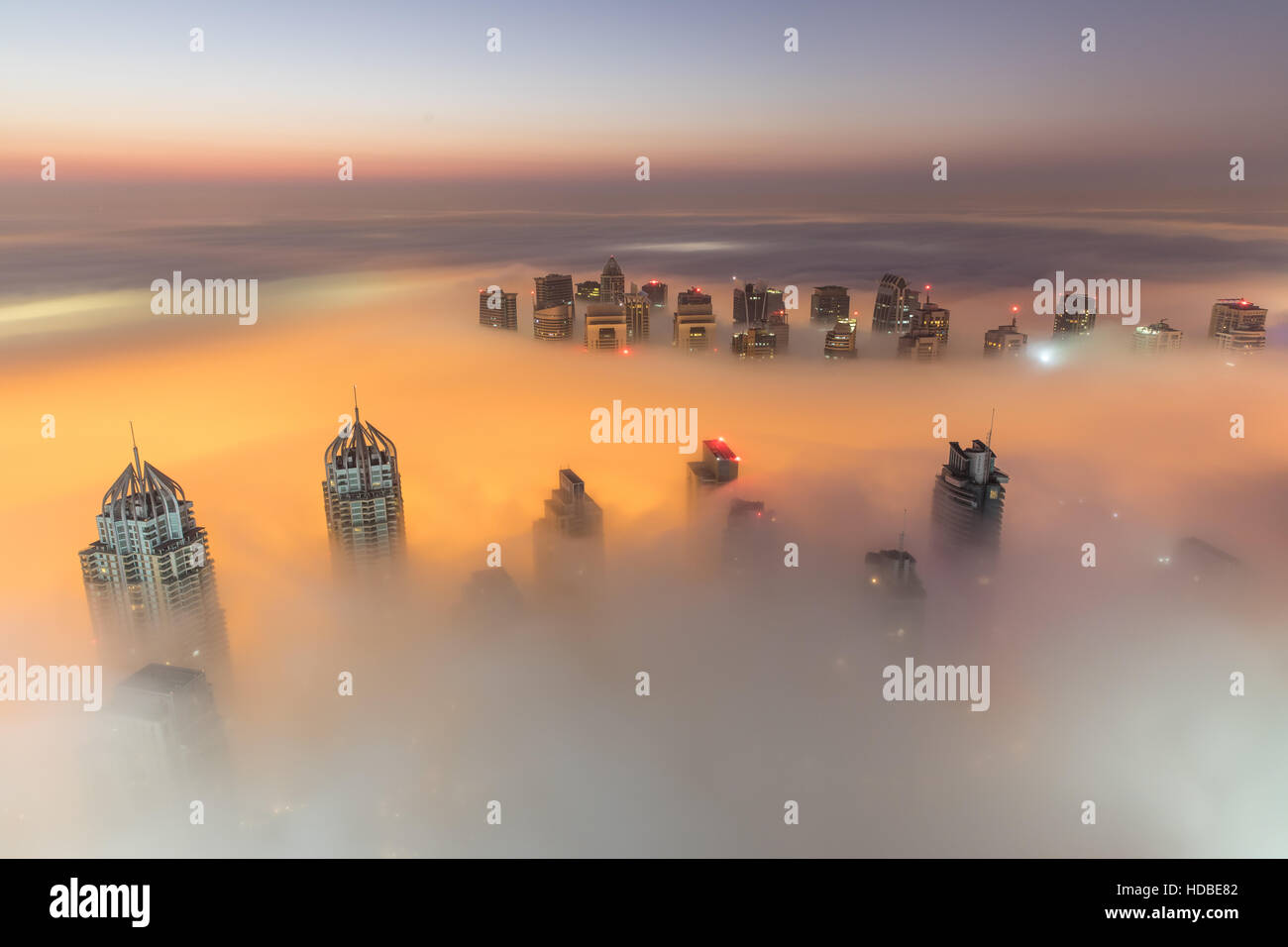 Rare winter morning fog blanketing Dubai skyscrapers. Dubai, UAE. Stock Photo