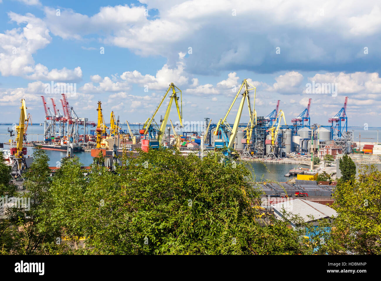 Lifting cargo cranes, ship and grain dryer in Sea Port of Odessa, Black Sea, Ukraine. Industrial view Stock Photo