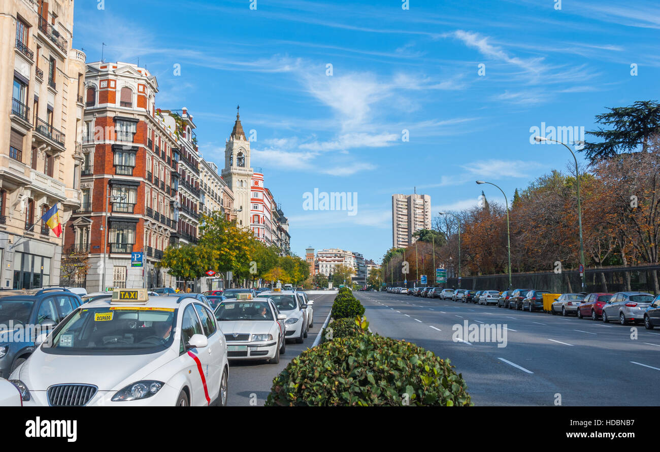 Postcards from Spain.  Taxis in traffic wait for the light on Alica street in Madrid, Spain. Stock Photo