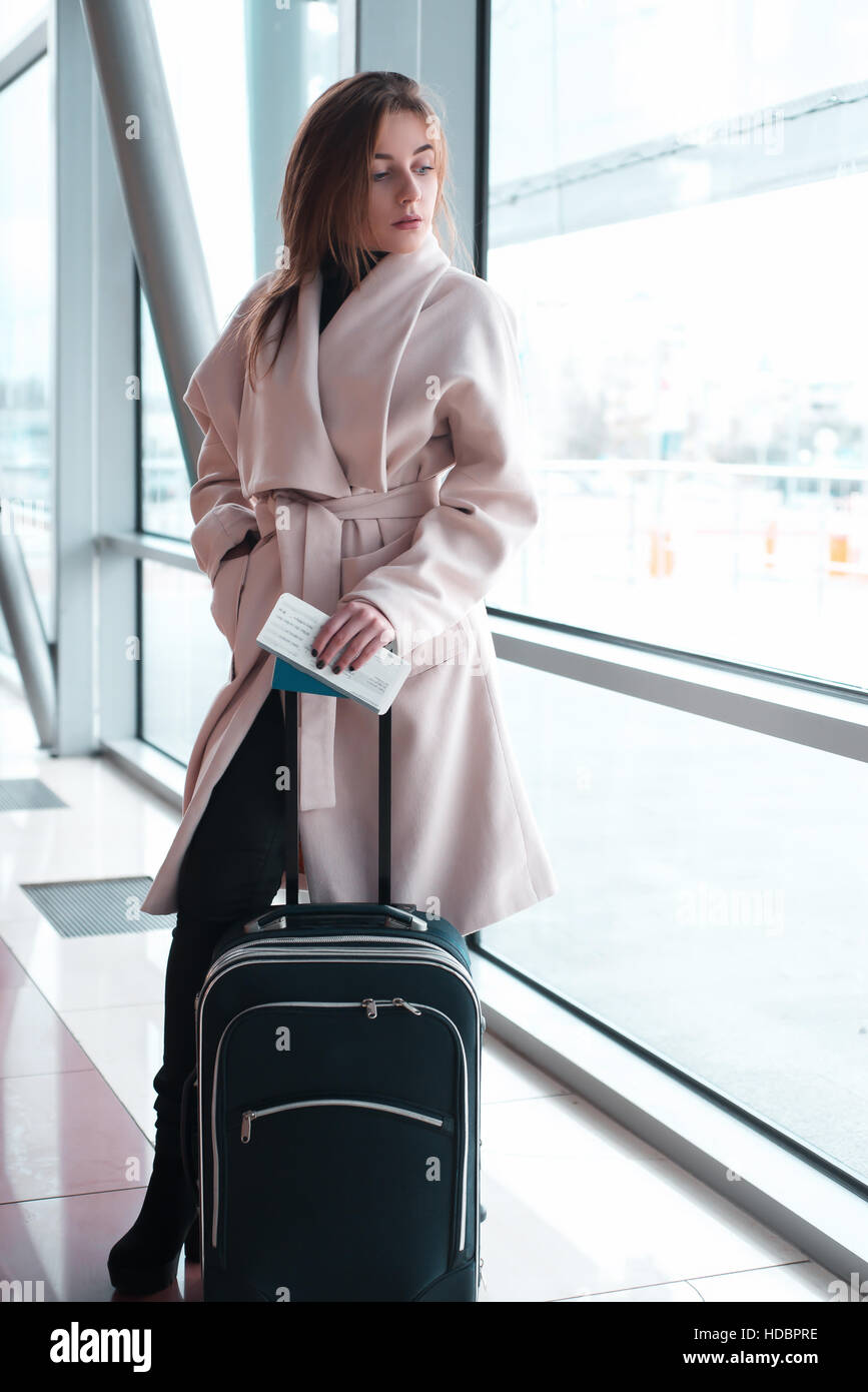 Woman in airport hi-res stock photography and images - Alamy