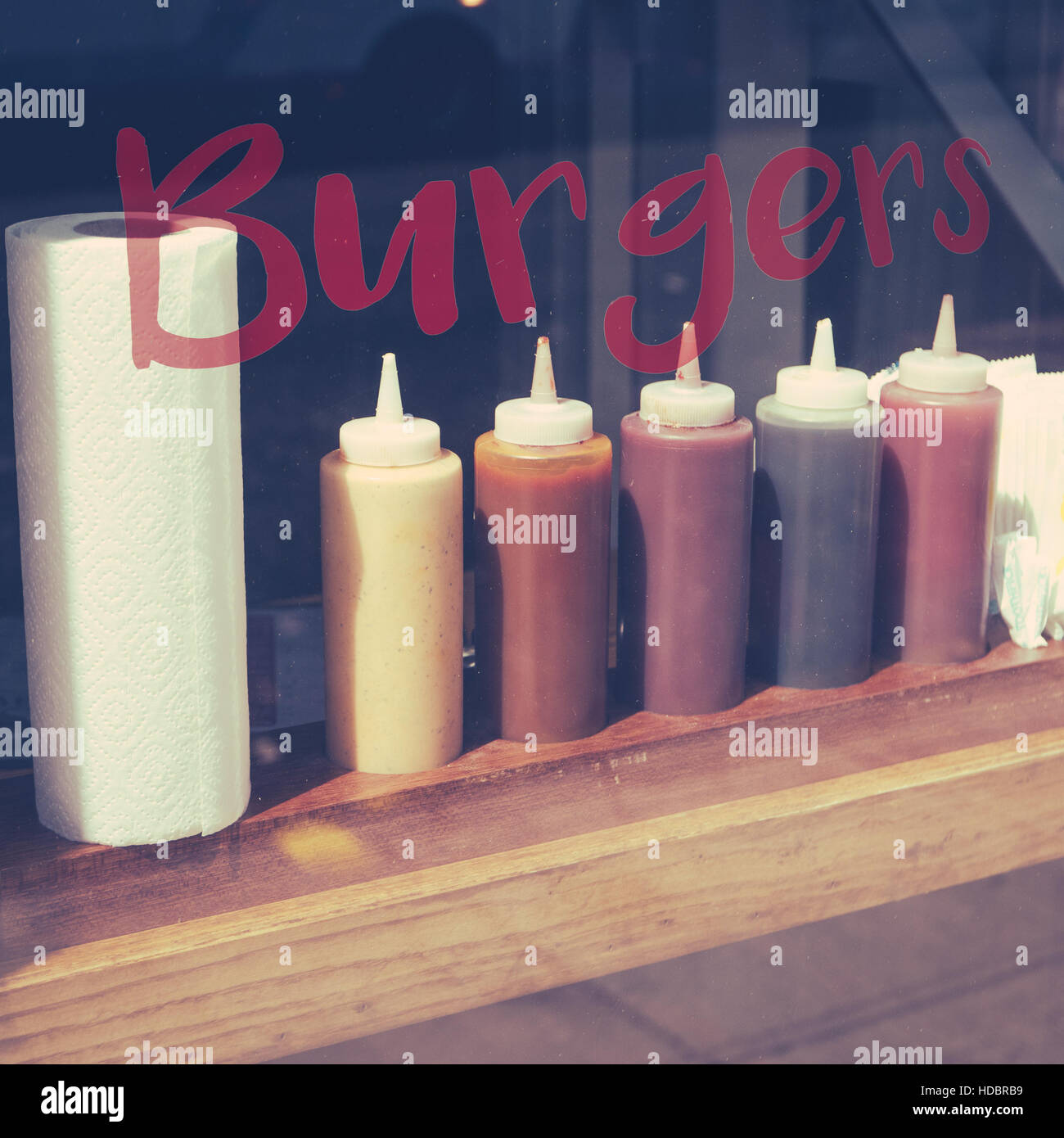 Row Of Sauces In The Window Of A Burger Restaurant Stock Photo