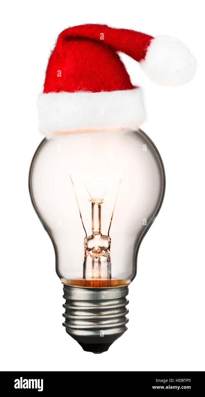 Glowing light bulb with a christmas hat isolated on white background with a clipping path Stock Photo