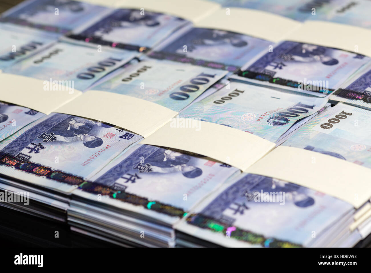 Stacks of New Taiwan Dollar bills Stock Photo
