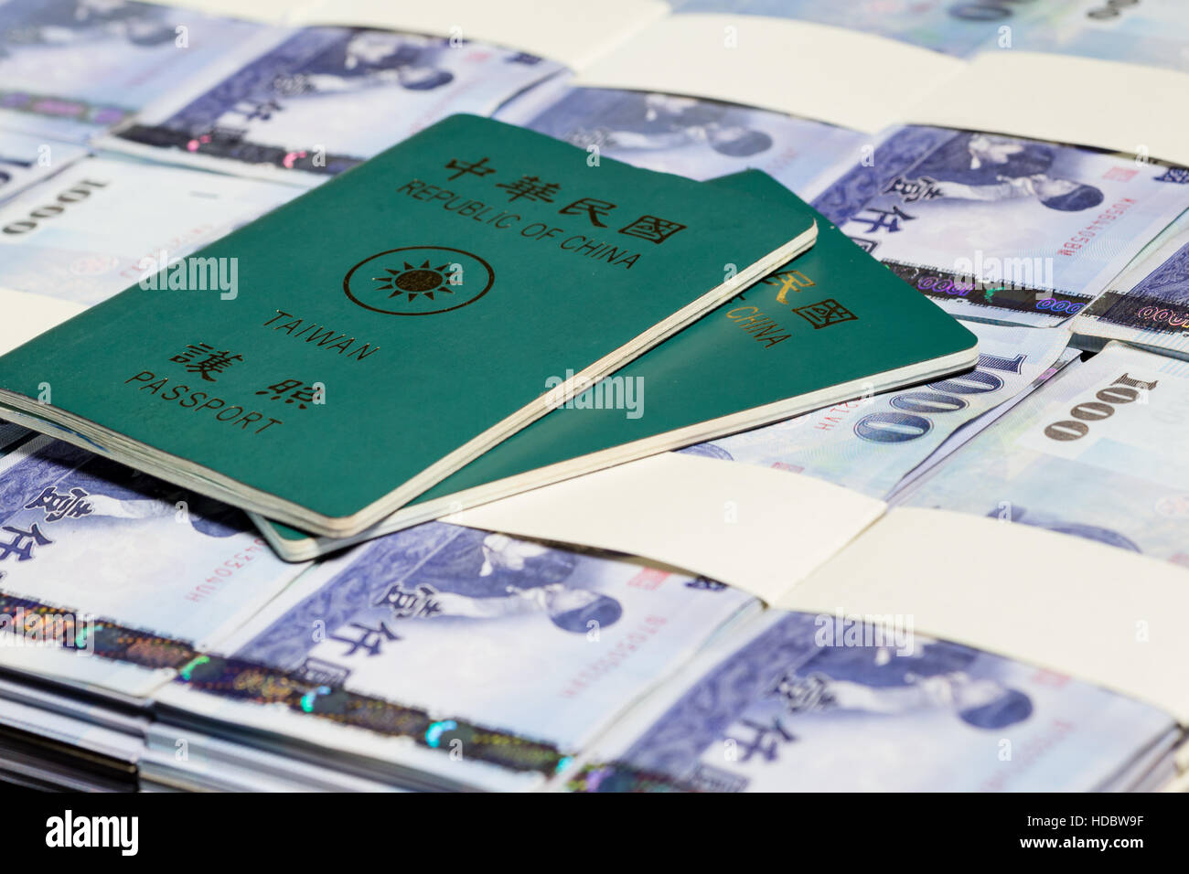 NT dollars in stacks with ROC passport Stock Photo - Alamy