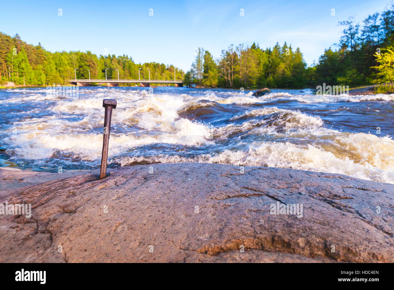 Langinkoski, fast running river water and coastal stones. Kotka, Finland. Black and white natural photo Stock Photo