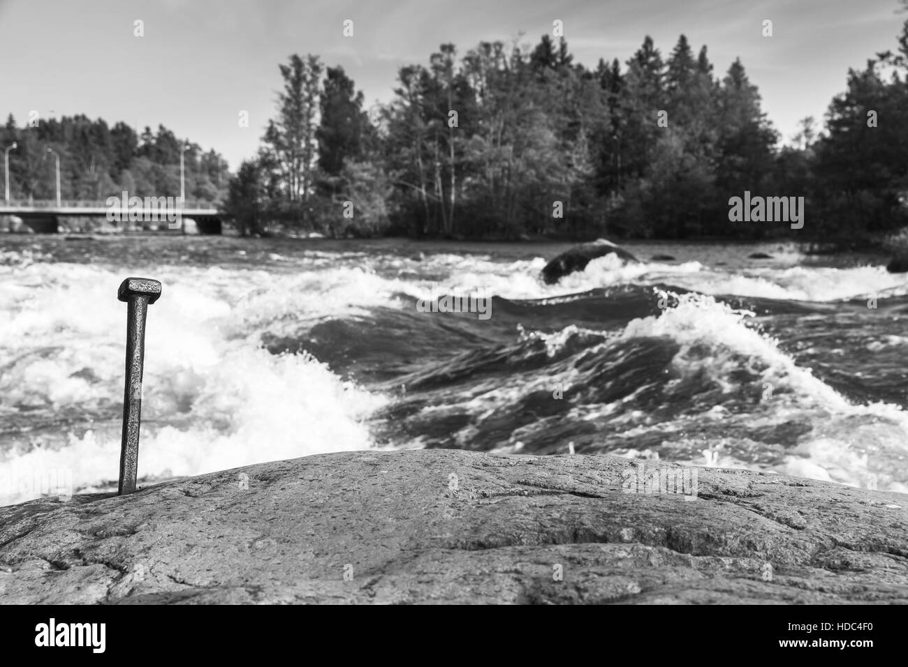 Langinkoski, fast running river water in Kotka, Finland. Black and white natural photo Stock Photo