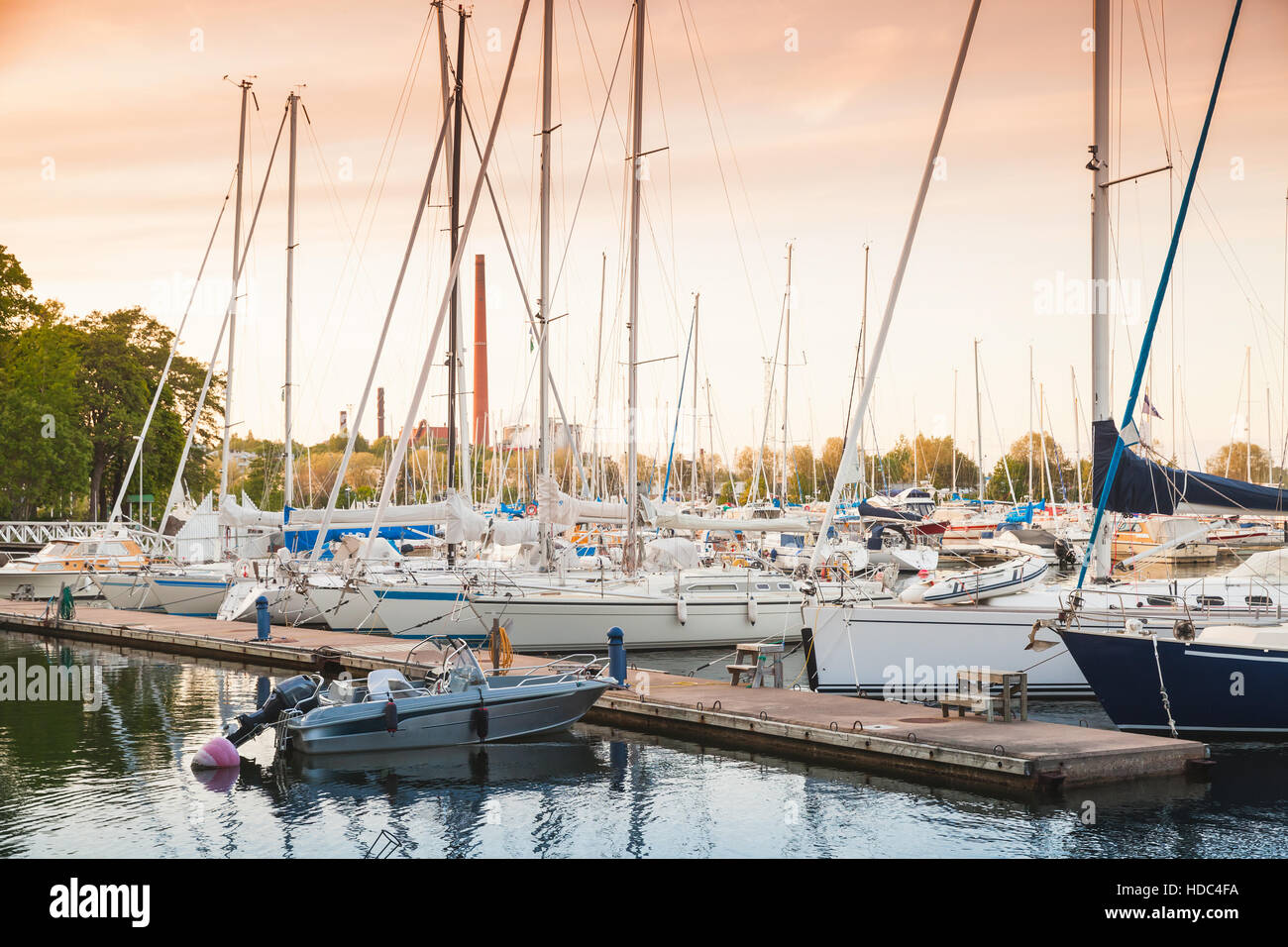 Sailing yachts and pleasure motorboats are moored in marina of Kotka, Finland Stock Photo