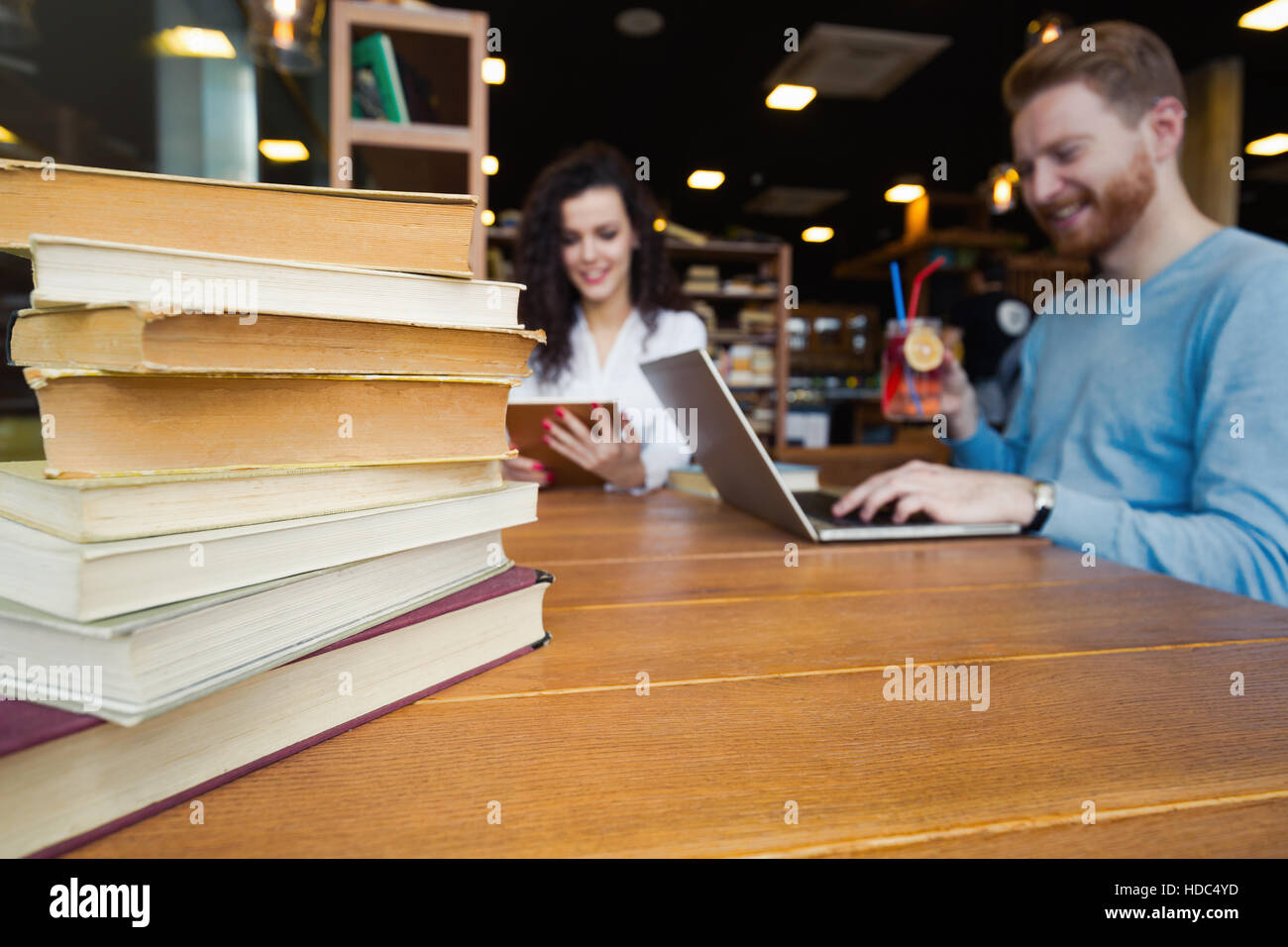 Young students studying in library for exam Stock Photo