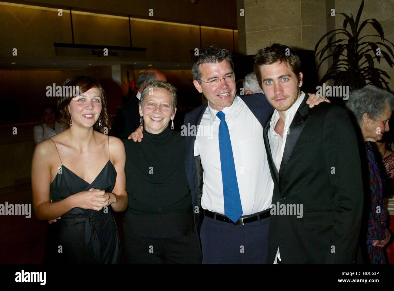 Maggie Gyllenhaal, her mother, Naomi Foner Gyllenhaal, her father, Stephen Gyllenhaal, and brother Jake Gyllenhaal arrive at the ACLU Torch of Liberty Awards on May 19, 2003 in Beverly Hills, California. Photo by Francis Specker Stock Photo