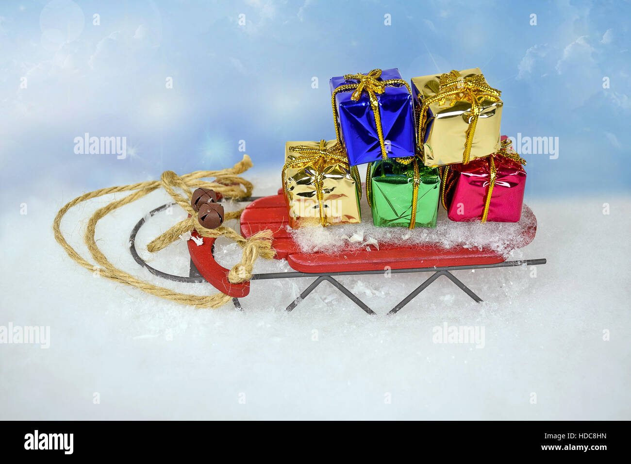 retro sled in snow with Christmas gifts Stock Photo