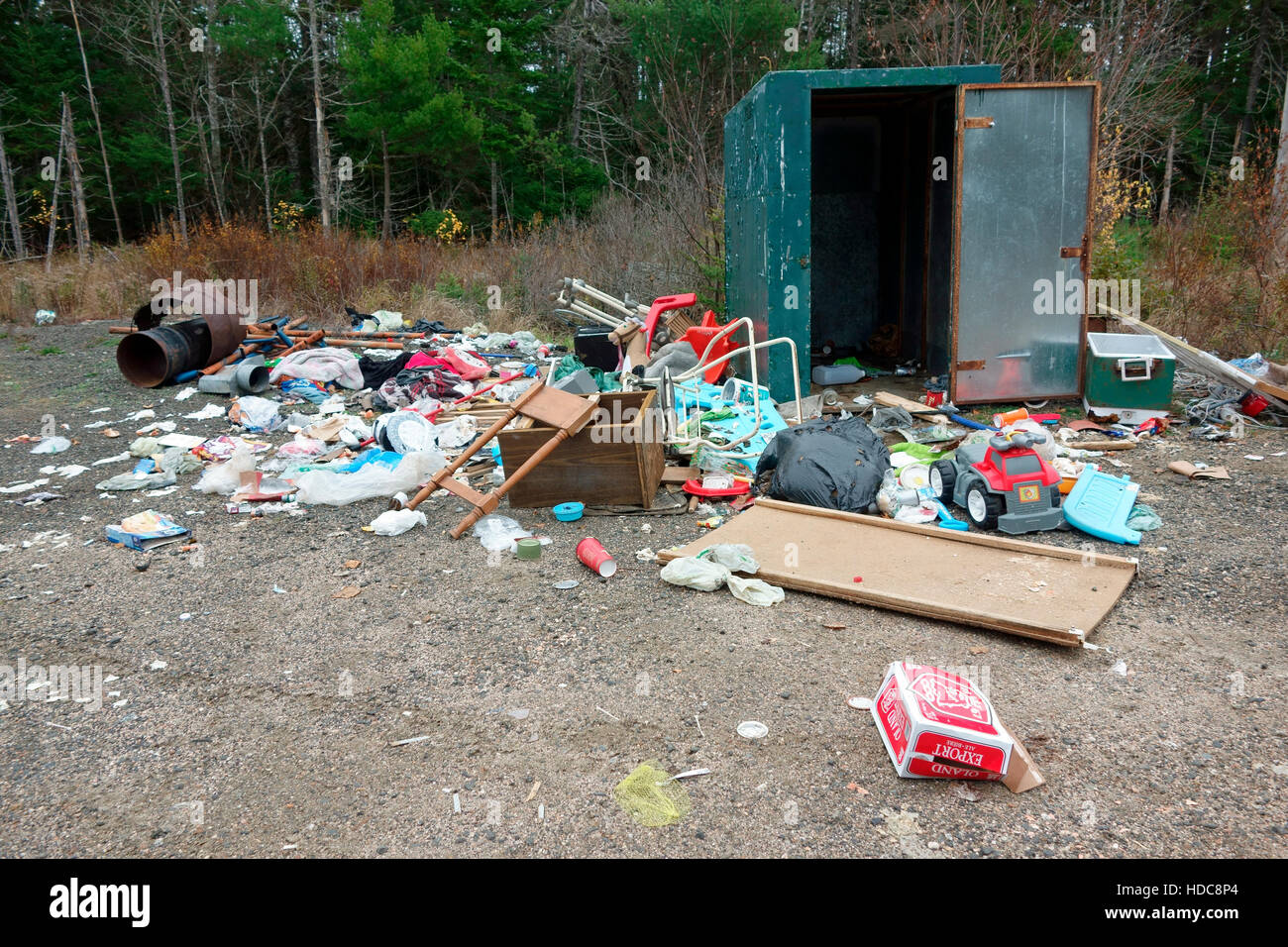 Trash strewn by a bear from a container Stock Photo