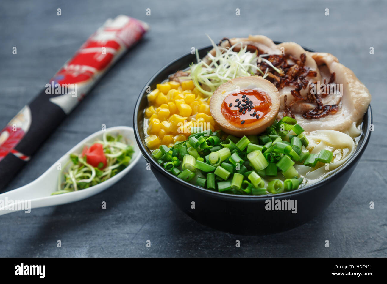 japanese tonkotsu ramen, pork bone broth noodles with chashu, egg, corn