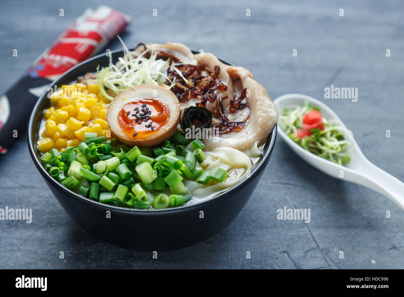 japanese tonkotsu ramen, pork bone broth noodles with chashu, egg, corn