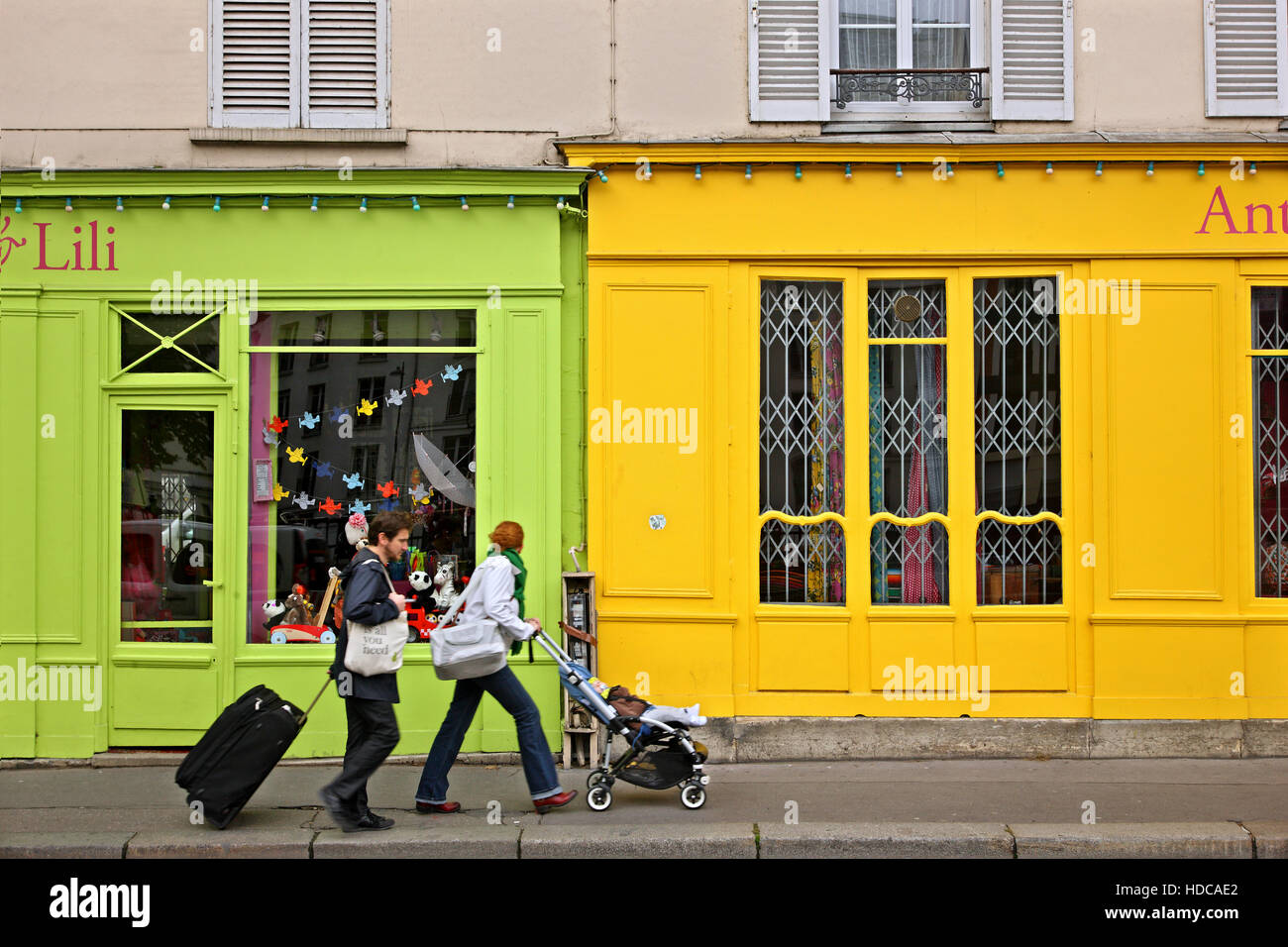 Colorful shops right next to the canal Saint-Martin, Paris, France Stock Photo
