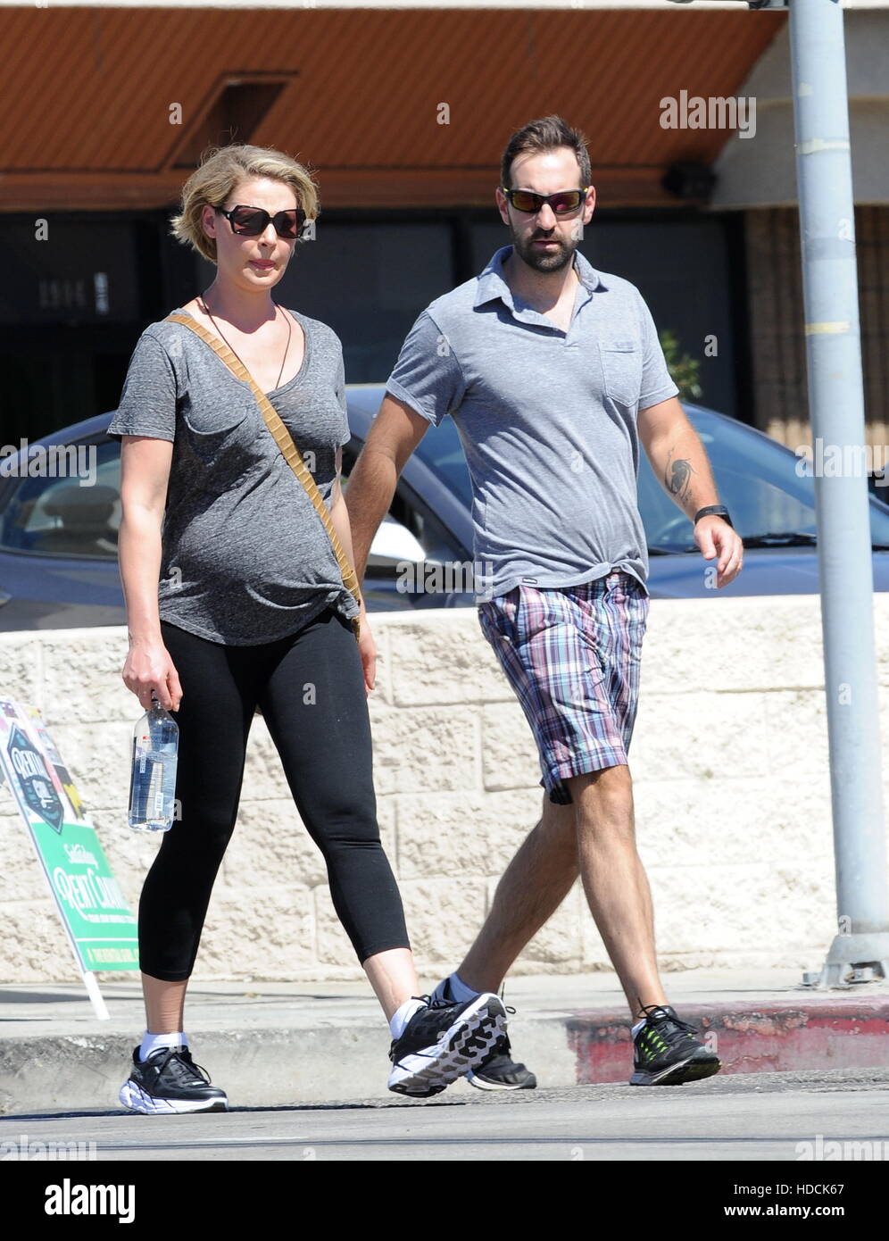 Pregnant Katherine Heigl shows off her baby bump in a tight tee while
