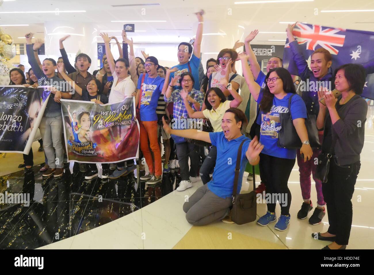 Pasay, Philippines. 10th Dec, 2016. Fans cheers just outside the party area. Miss Universe officially started in the Philippines with its Kick-off Party at S Maison Mall, Conrad Hotel, SM Mall of Asia, Pasay City at 7:00pm. Presented with Pia Wurtzbach, reigning Miss Universe, candidates from Australia, Japan, Indonesia, Korea, Malaysia, Myanmar, New Zealand, Philippines, Thailand, Vietnam and USA. Credit:  George Buid/Pacific Press/Alamy Live News Stock Photo