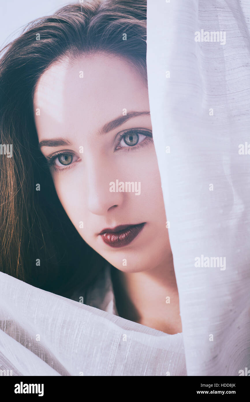 Serious young woman looking away Stock Photo