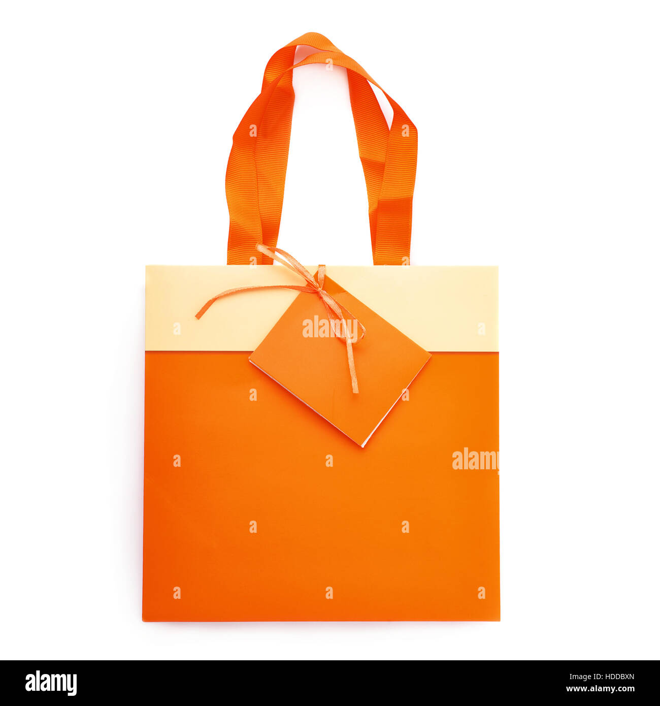 Orange shopping or gift bag with label isolated over the white background Stock Photo