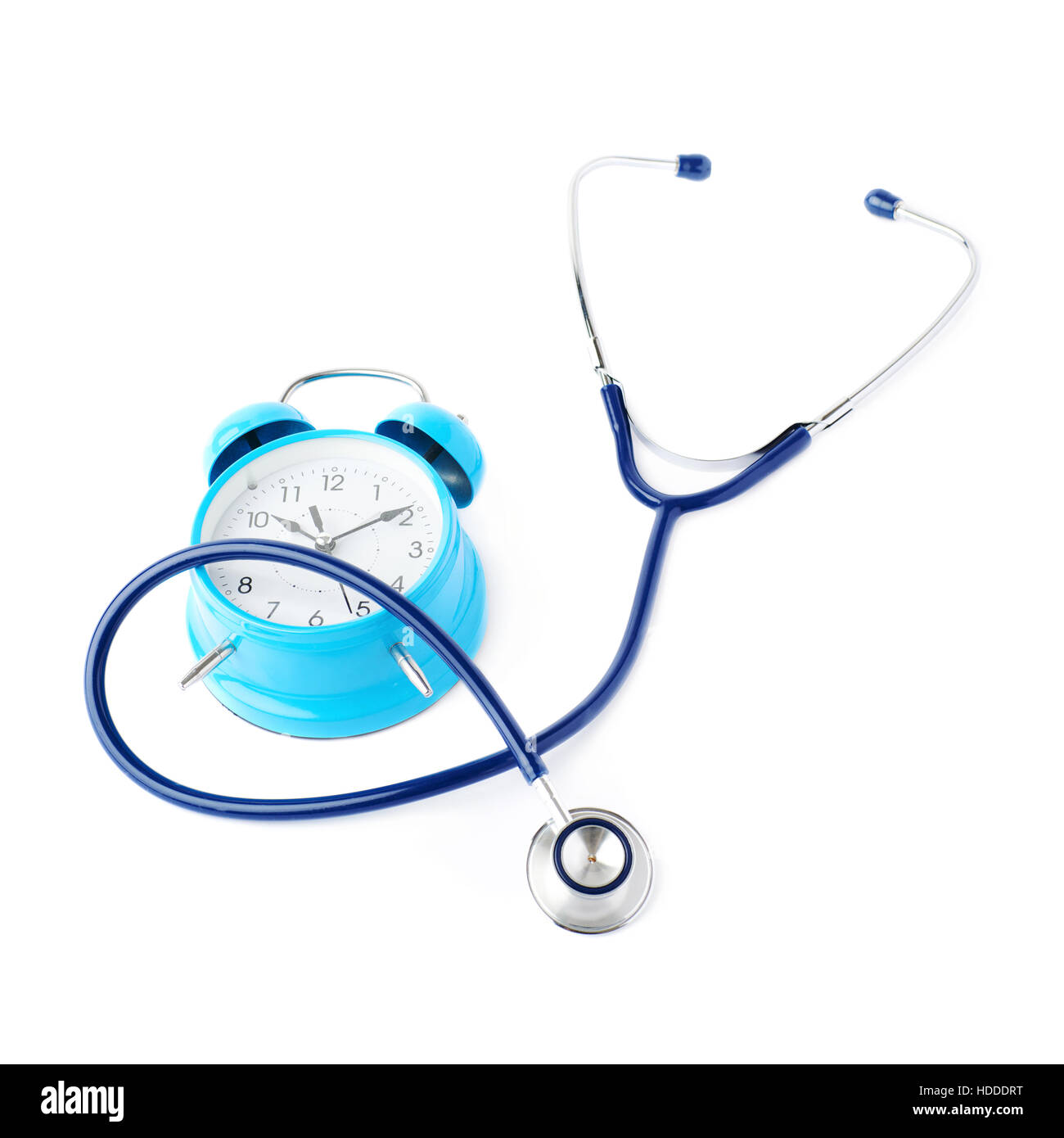 Close up view of blue stethoscope with alarm clock over isolated white background Stock Photo