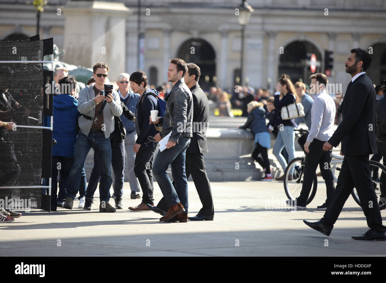 Filming of 'American Assassin' in London. Actor Taylor Kitsch films a scene alongside tourists and Londoners in Trafalgar Square. Camera crews were spotted on the roof of a museum as filming took place on the square below.  Featuring: Taylor Kitsch Where: Stock Photo