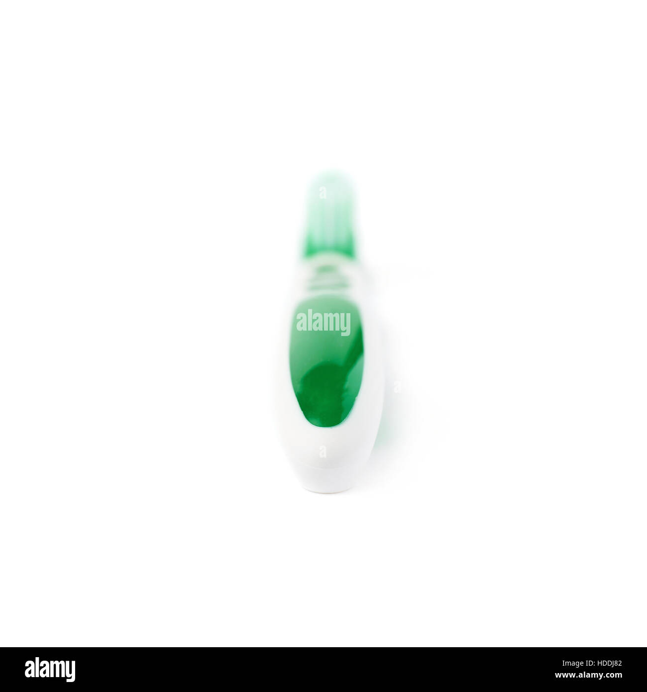 Green toothbrush isolated over white background Stock Photo - Alamy