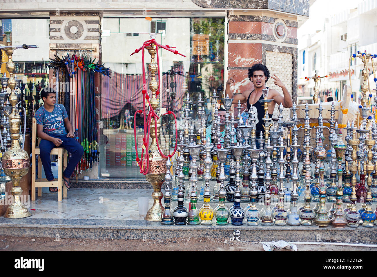 Egypt Sharm el sheikh - august 2016: hookah shop bazaar sell with friendly dealer, friendliness gestures Stock Photo