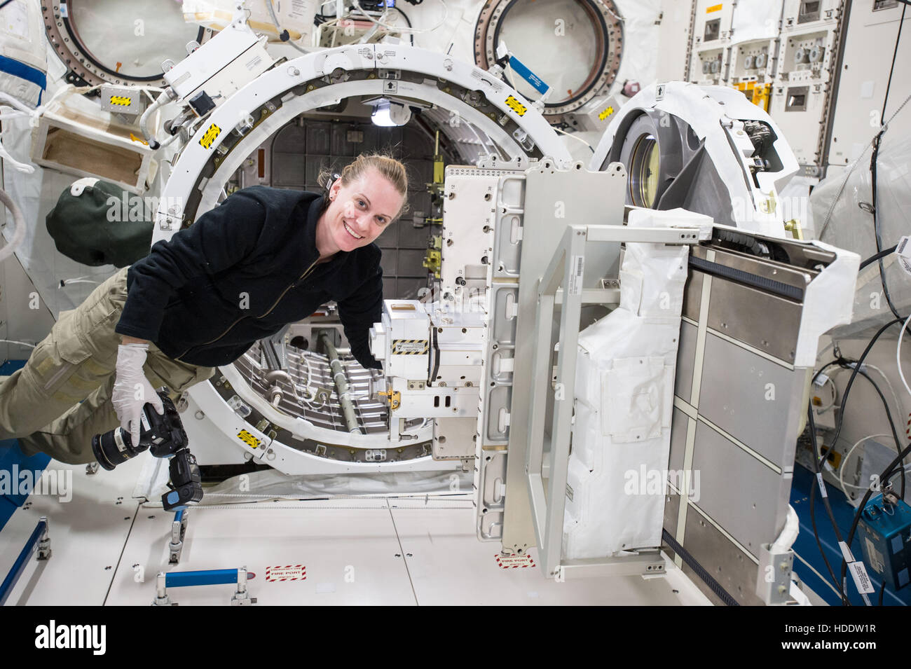 NASA International Space Station Expedition 49 crew member astronaut Kate Rubins works inside the Japanese Experiment Module Kibo September 27, 2016 while in Earth orbit. Stock Photo