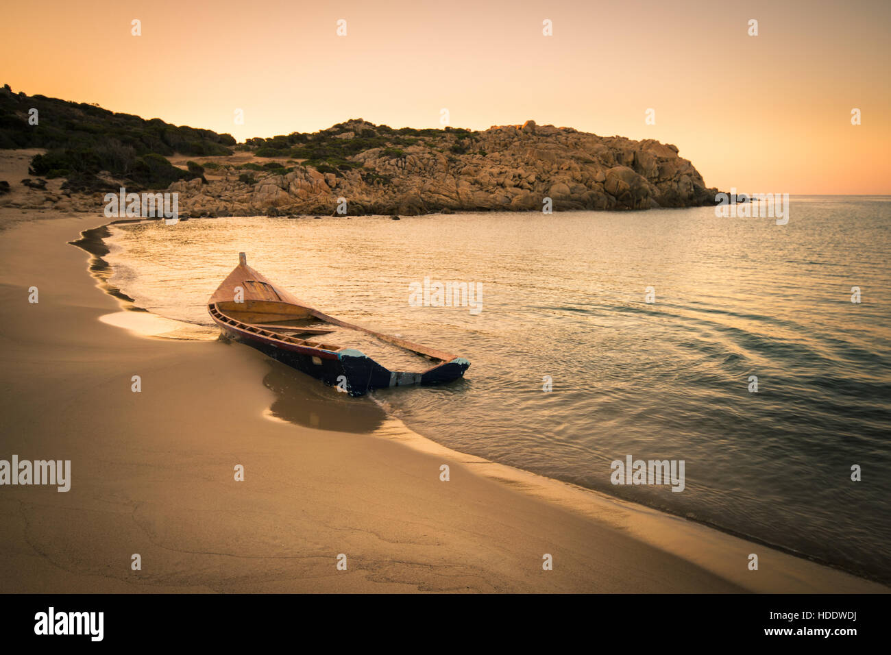 Old wooden boat wrecked on a sandy beach Stock Photo - Alamy
