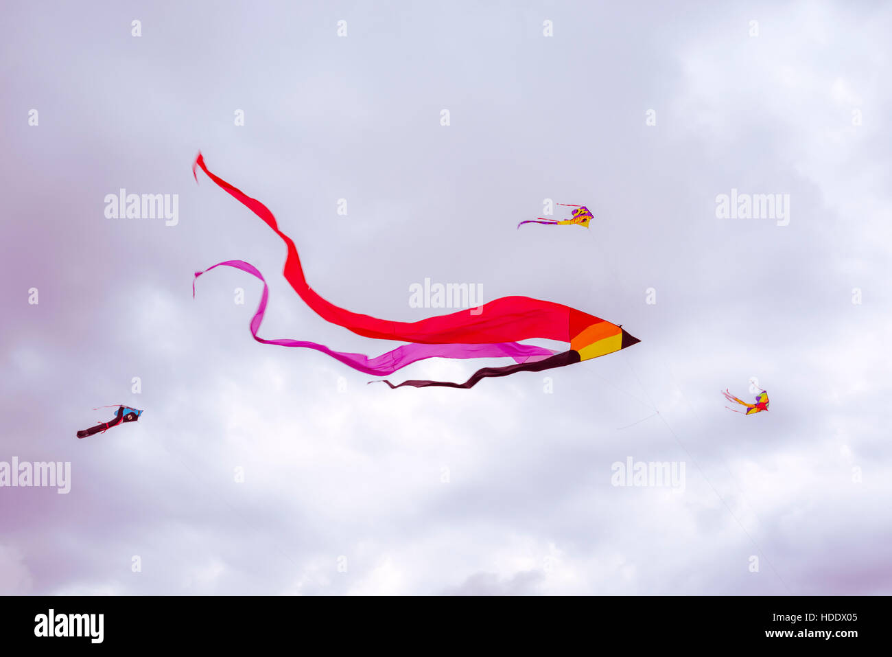 kites flying against a cloudy sky. Stock Photo