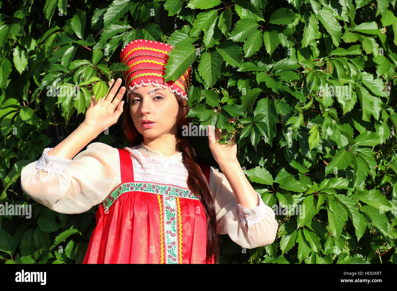 cute pretty girl in a traditional Slavic dress on nature in an unspoilt