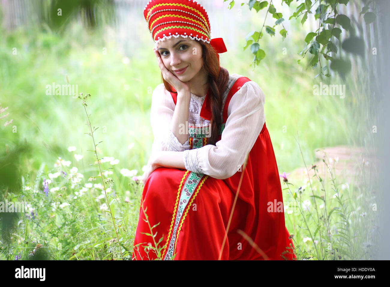 cute pretty girl in a traditional Slavic dress on nature in an unspoilt