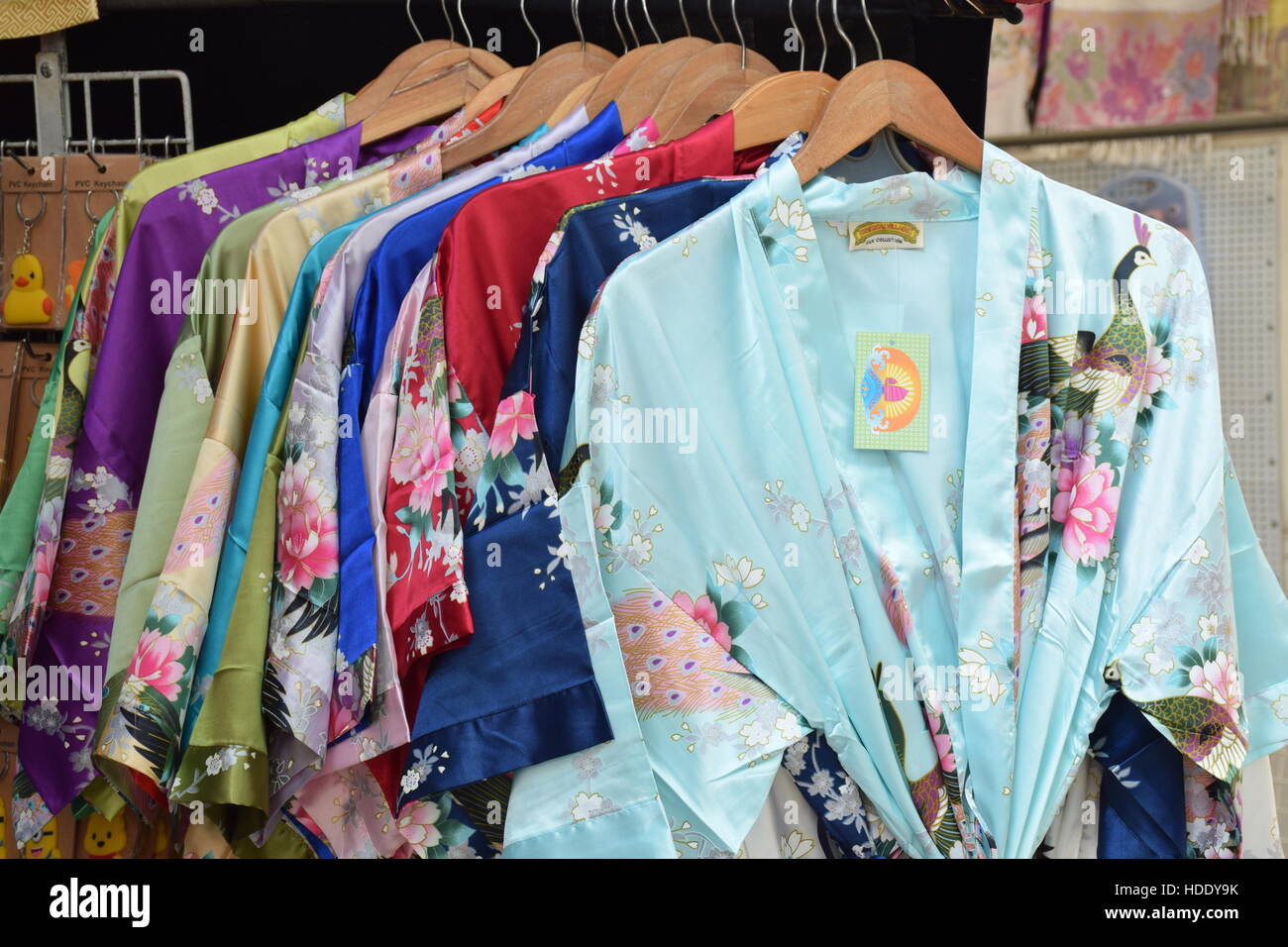 Colorful traditional chinese clothes hanging in a market stall in Hong