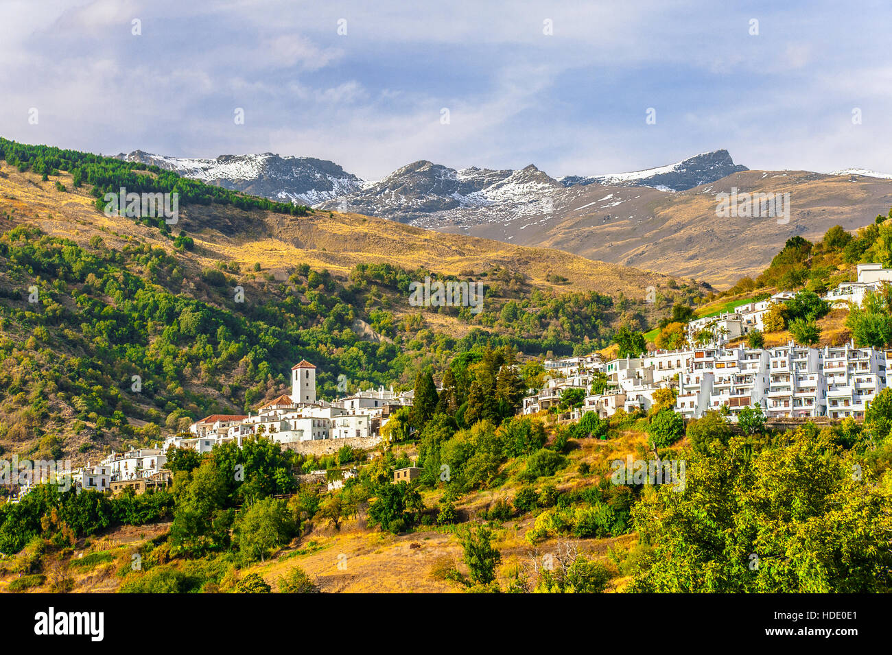 white village Capileira in the Alpujarra and the peak of Mountain Mulhacén, Andalusia, Spain Stock Photo